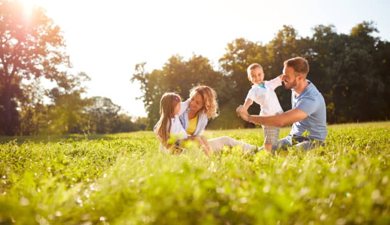 Family outside enjoying summer weather