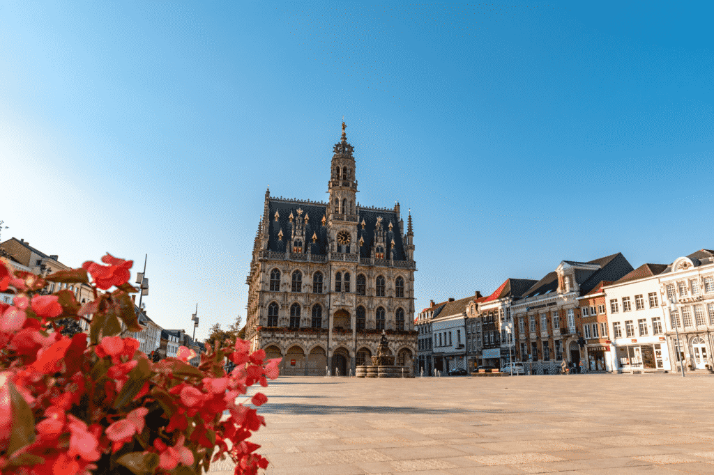 oudenaarde city hall with flowers in the front