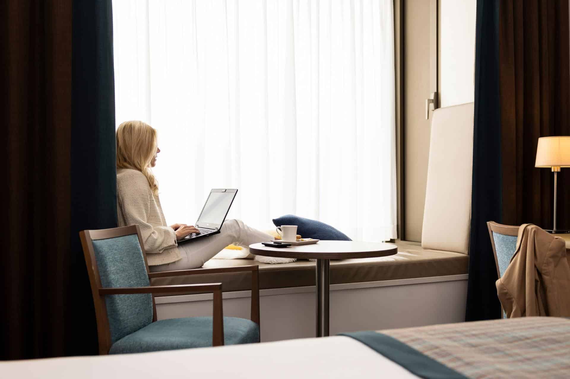 Woman working in our Executive Room Leopold Hotel Oudenaarde